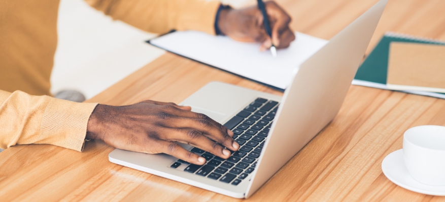 person typing on laptop