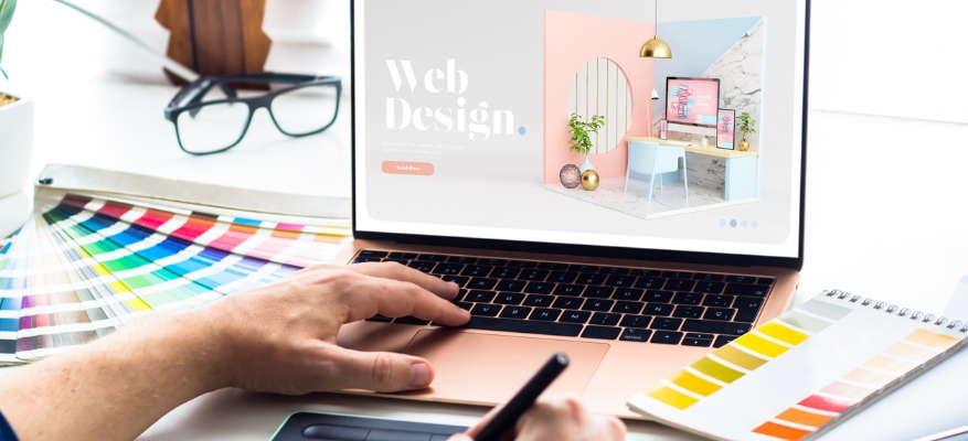 Web design desktop with laptop and tools