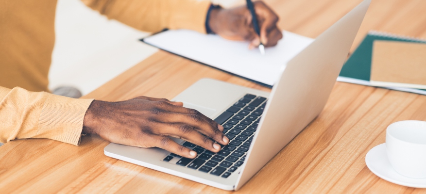 person typing on laptop 