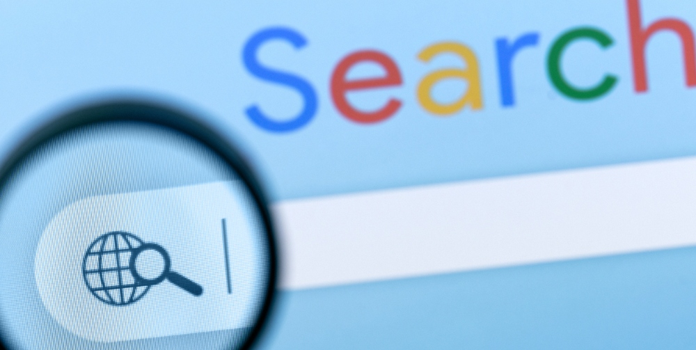 Internet browser search bar with magnifier on computer screen with text Search